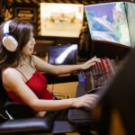 a woman sitting in her PC gaming station playing grand strategies