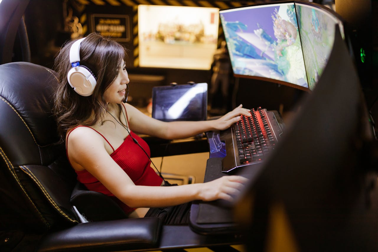 a woman sitting in her PC gaming station playing grand strategies