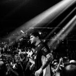 s1mple walking in front of a large crowd of CS2 fans