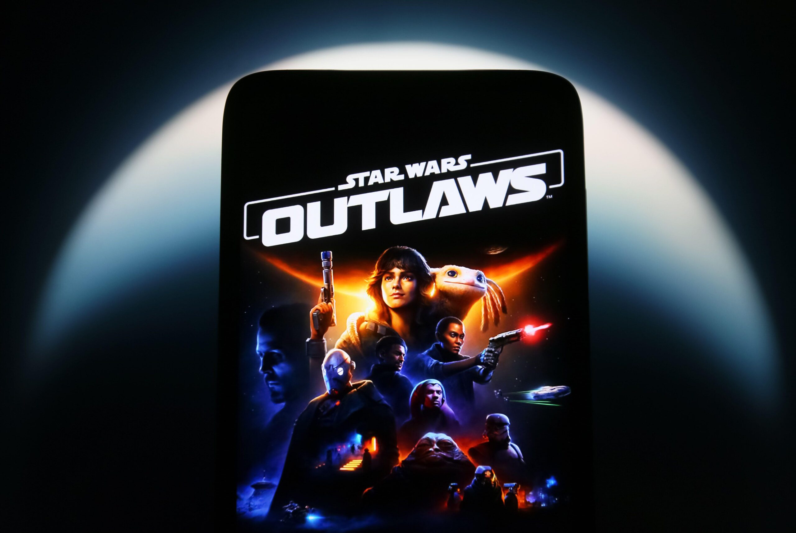 a picture of Star Wars Outlaws video game on a phone
